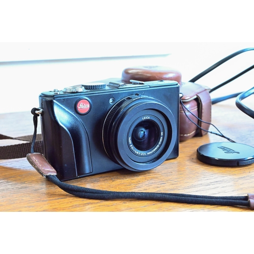 180 - A Leica D-Lux 4 digital pocket camera with leather case and battery-charger with spare battery