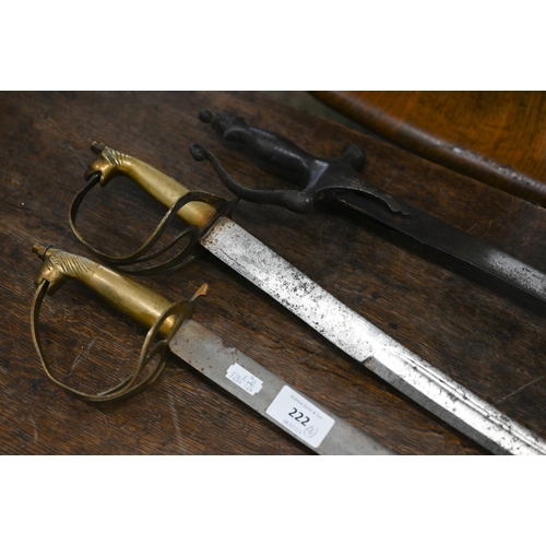 222 - A 19th century Indian sabre with curved and fullered 77 cm blade and cast tulwar hilt to/w two later... 