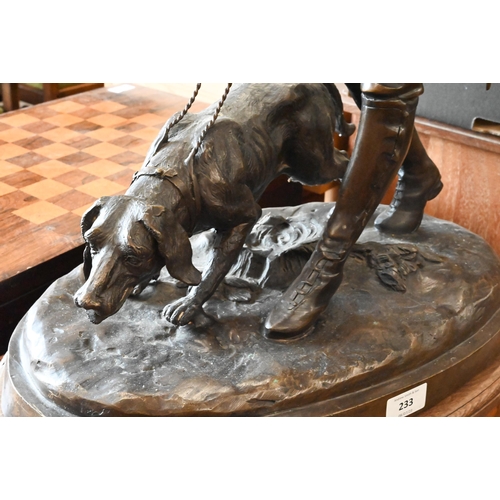 233 - A large Continental bronze group of a huntsman and dog, unsigned, 62 cm high on oval base