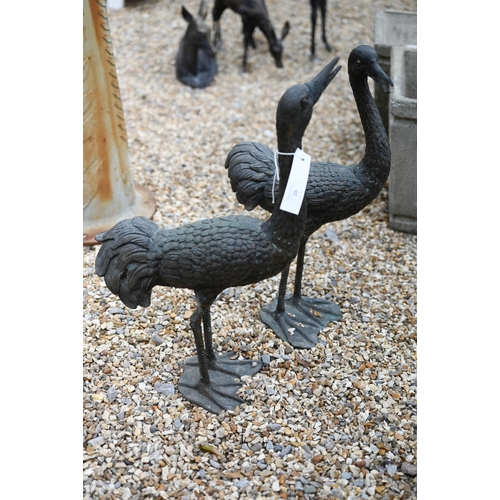 26 - A companion pair of weathered bronze patinated garden birds