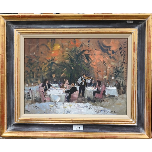 282 - Robert King (b 1936) - 'Restaurant in Budapest', oil on canvas, signed, 29 x 39 cm 