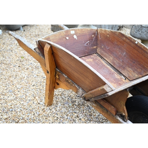 29 - An old teak wheelbarrow