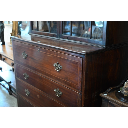 331 - A 19th century mahogany secretaire bookcase with glazed doors enclosing three shelves over the base ... 