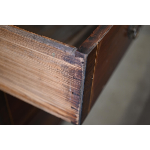 331 - A 19th century mahogany secretaire bookcase with glazed doors enclosing three shelves over the base ... 