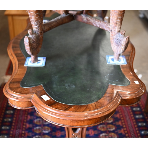 334 - A Victorian mahogany centre table, the shaped top inset with tooled green leather raised on carved s... 