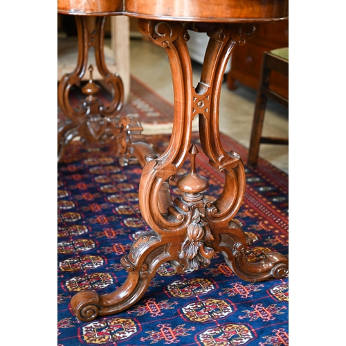 334 - A Victorian mahogany centre table, the shaped top inset with tooled green leather raised on carved s... 