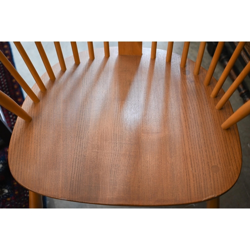 340 - An Ercol (model 472) elm and beech spindle back Windsor chair gold label to back underside seat, cir... 