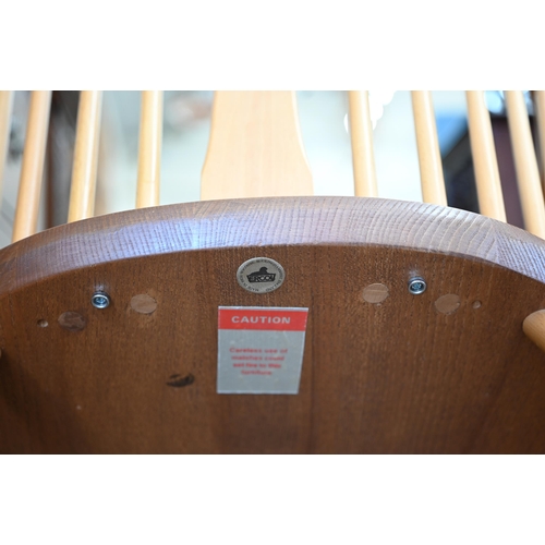 340 - An Ercol (model 472) elm and beech spindle back Windsor chair gold label to back underside seat, cir... 