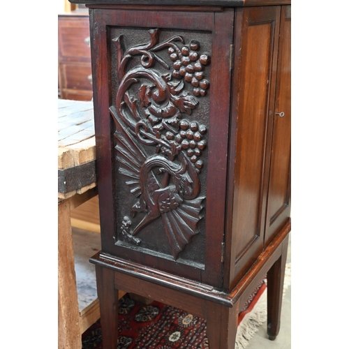 342 - # A mahogany two door cabinet with shelved interior and dragon carved side panels, 56 cm wide x 45 c... 