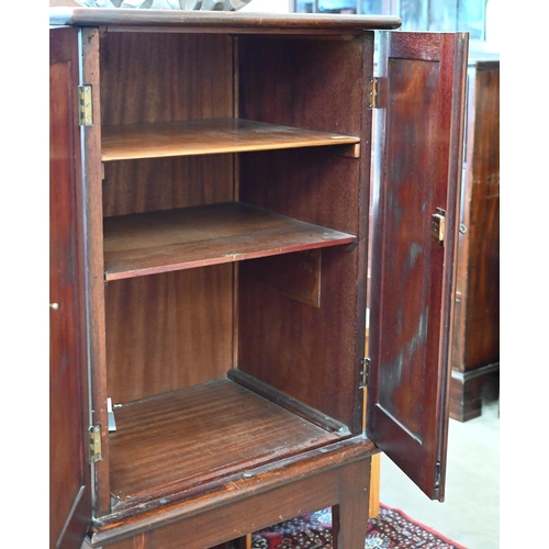 342 - # A mahogany two door cabinet with shelved interior and dragon carved side panels, 56 cm wide x 45 c... 