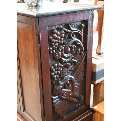 342 - # A mahogany two door cabinet with shelved interior and dragon carved side panels, 56 cm wide x 45 c... 