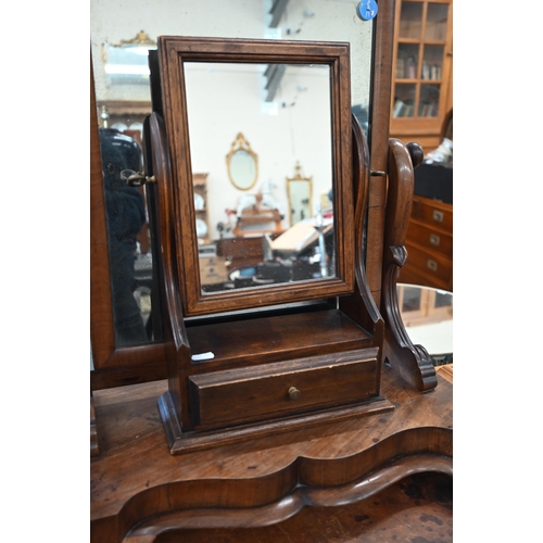 345 - A Victorian mahogany framed rectangular toilet mirror on shaped base, 55 cm wide x 30 cm deep x 62 c... 