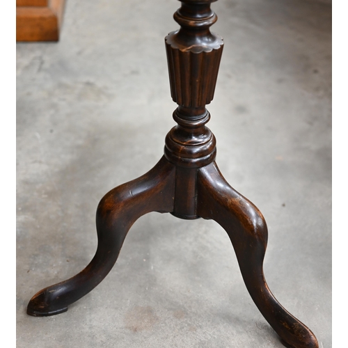 348 - A 19th century mahogany torchère, the circular top on turned column and triform supports, 120 cm hig... 