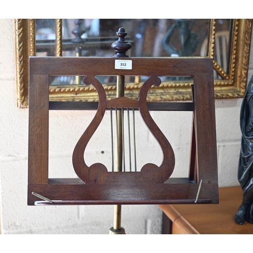 352 - A mahogany and brass adjustable lyre design single music stand on turned column and triform supports