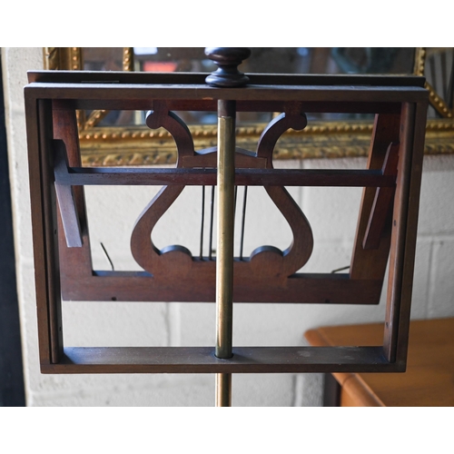 352 - A mahogany and brass adjustable lyre design single music stand on turned column and triform supports