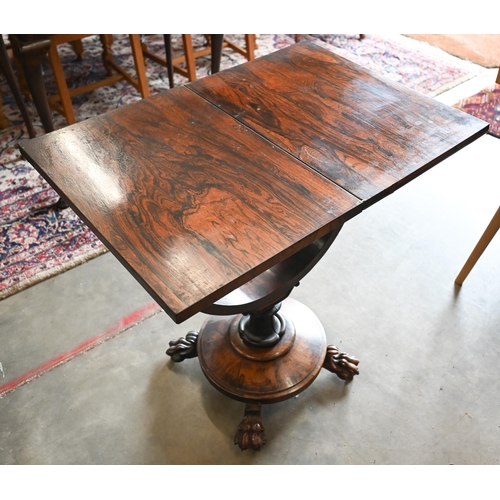 354 - A Victorian rosewood and maple games table with folding chessboard top and single drawer, circular p... 