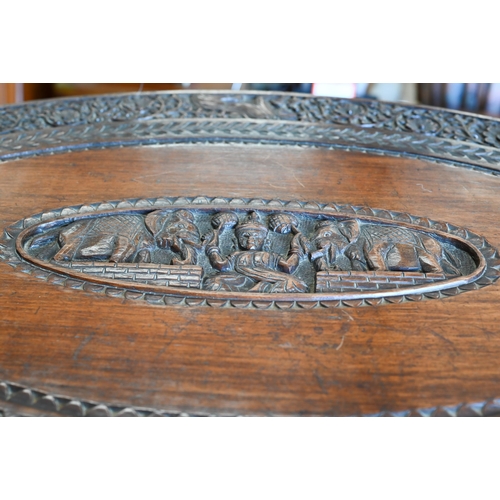 356 - An Anglo-Indian hardwood 'elephant' table, the oval top profusely carved with swaths of repeating fo... 