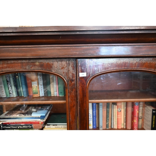 374 - # A Victorian mahogany bookcase with glazed doors enclosing four shelves, standing on deep plinth ba... 