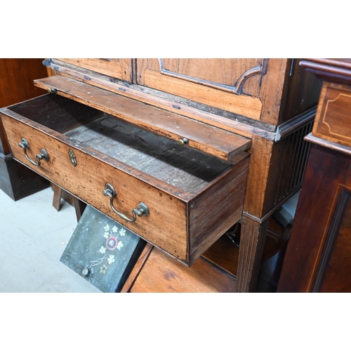 377 - A 19th century side cabinet with two panelled cupboards enclosing adjustable shelves over brushing s... 