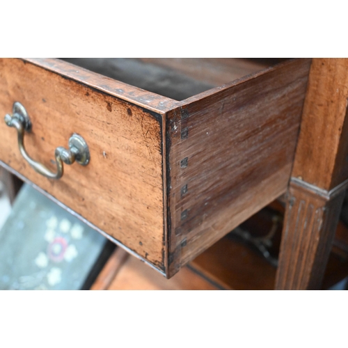 377 - A 19th century side cabinet with two panelled cupboards enclosing adjustable shelves over brushing s... 