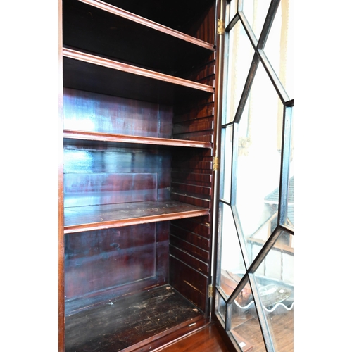 379 - A 19th century mahogany inlaid cabinet bookcase with astragal glazed doors over shallow drawer and p... 