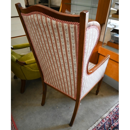 391 - # An Edwardian walnut framed salon armchair with floral striped upholstery