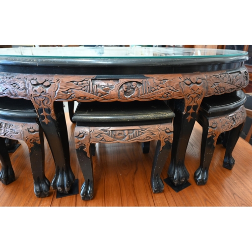 399 - A Chinese part lacquered and carved hardwood oval table, the top with applied imitation mother-of-pe... 