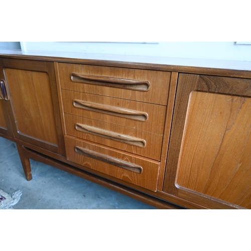 400 - A mid-century G-Plan fresco teak sideboard, four graduating central drawers flanked by panelled cupb... 