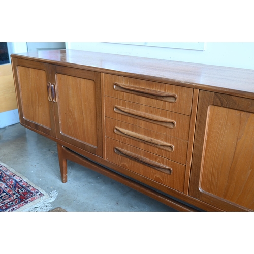 400 - A mid-century G-Plan fresco teak sideboard, four graduating central drawers flanked by panelled cupb... 