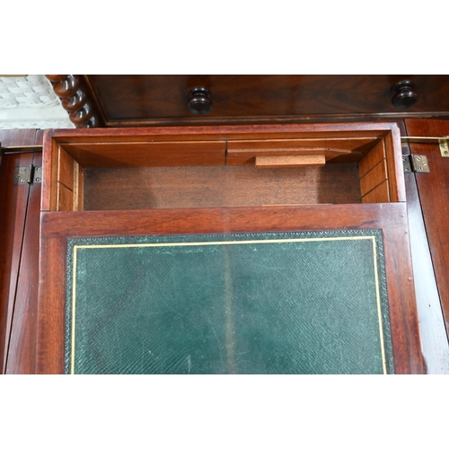 414 - An Edwardian mahogany pop-up writing table with twin hinged panelled top enclosing rise and fall two... 