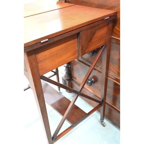 414 - An Edwardian mahogany pop-up writing table with twin hinged panelled top enclosing rise and fall two... 