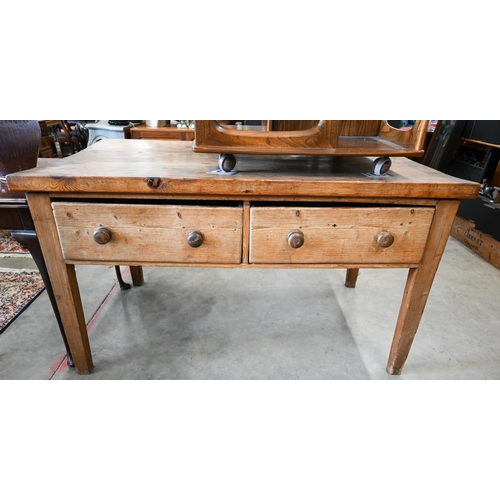 427 - An antique provincial waxed pine table with two deep frieze drawers on tapering supports, 146 cm x 8... 