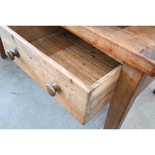 427 - An antique provincial waxed pine table with two deep frieze drawers on tapering supports, 146 cm x 8... 