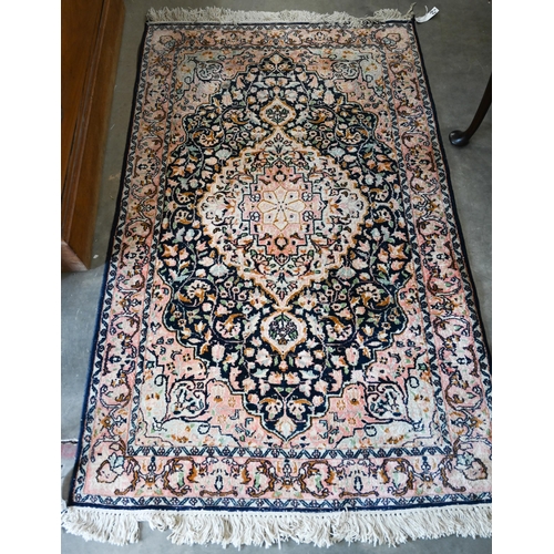 428 - Two Indo-Persian traditional floral design blue ground rugs, 150 x 94 cm and 154 x 94 cm (2)