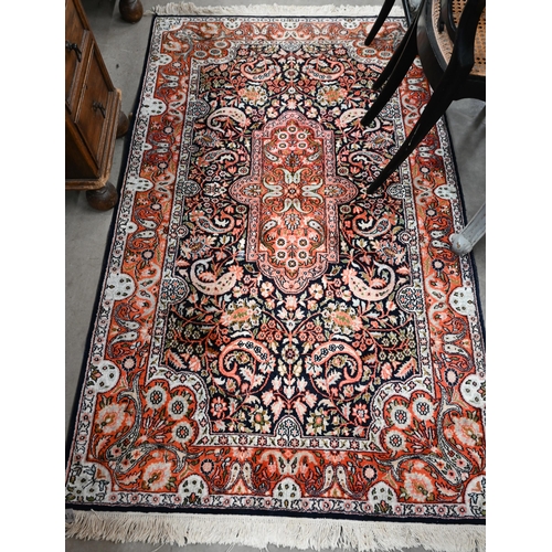 428 - Two Indo-Persian traditional floral design blue ground rugs, 150 x 94 cm and 154 x 94 cm (2)