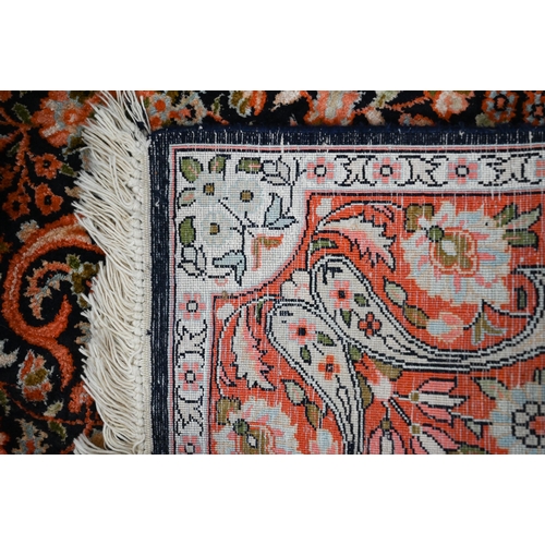 428 - Two Indo-Persian traditional floral design blue ground rugs, 150 x 94 cm and 154 x 94 cm (2)