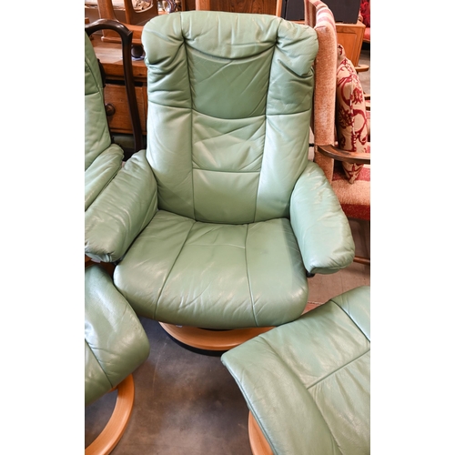 429 - Two Ekornes Stressless recliner armchairs in aqua green leather on classic base each with matching f... 