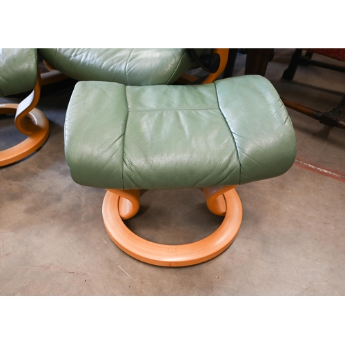 429 - Two Ekornes Stressless recliner armchairs in aqua green leather on classic base each with matching f... 