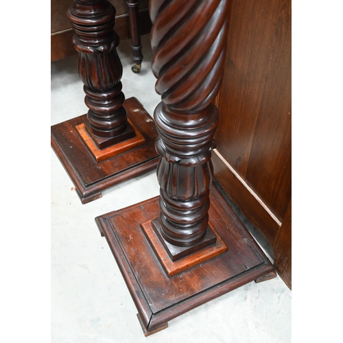 441 - A pair of stained hardwood spiral reeded torchères, 110 cm high (2)