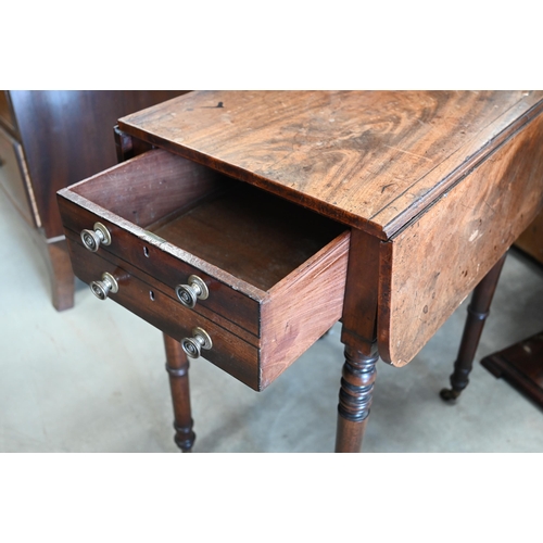 442 - A 19th century mahogany drop leaf side table with two drawers, turned supports and casters