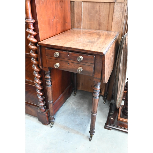 442 - A 19th century mahogany drop leaf side table with two drawers, turned supports and casters