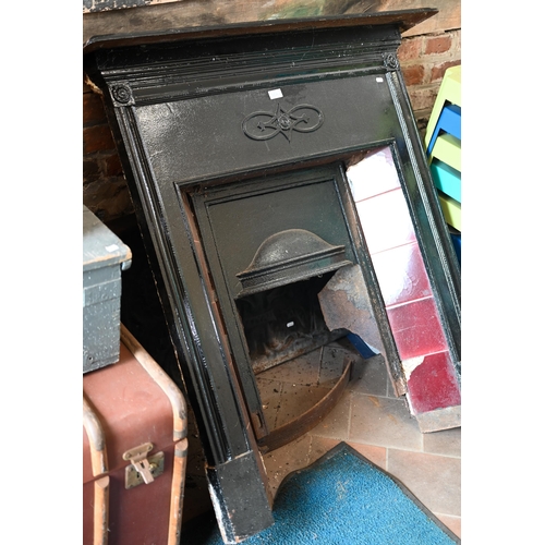 50A - # Cast iron fireplace with tiled slip - incomplete as removed to/w a traditional cast iron fireback,... 