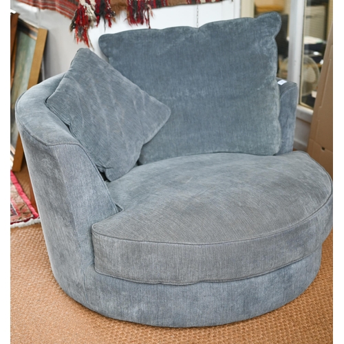 521 - A modern John Lewis blue-grey upholstered revolving loveseat c/with cushions