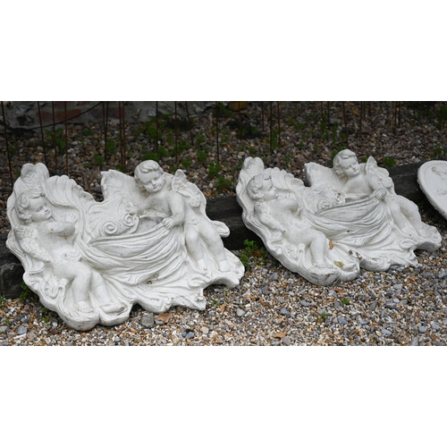 53 - Two weathered cast composite putti wall pockets, approximately 68 cm h x 72 cm w (2)