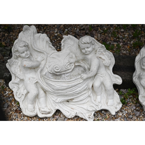 53 - Two weathered cast composite putti wall pockets, approximately 68 cm h x 72 cm w (2)