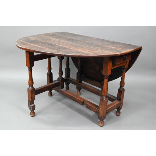 547 - An antique oak gateleg dining table