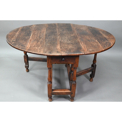 547 - An antique oak gateleg dining table