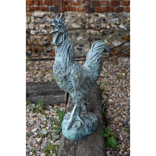 56 - A large verdigris patinated cast metal cockerel, 67 cm h and composite painted cockerel (a/f) (2)