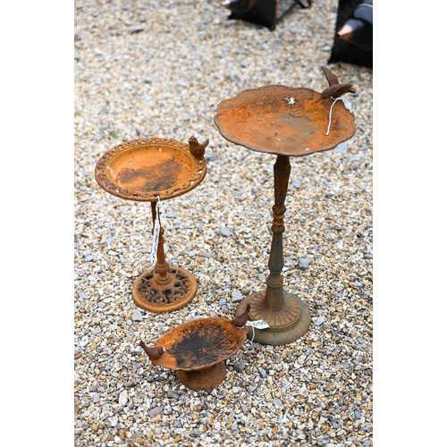 57 - A trio of weathered cast steel bird baths, the largest 54 cm h (3)