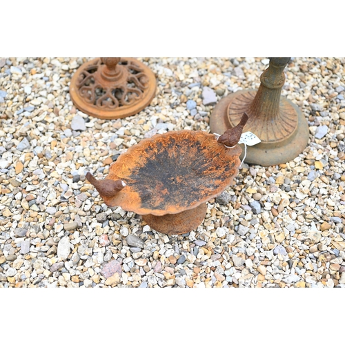 57 - A trio of weathered cast steel bird baths, the largest 54 cm h (3)